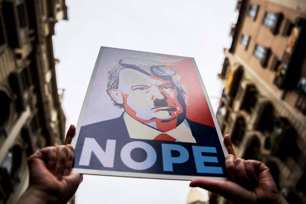 donald-trump-fascist-hitler-protest-sign-gettyimages-632281520.jpg